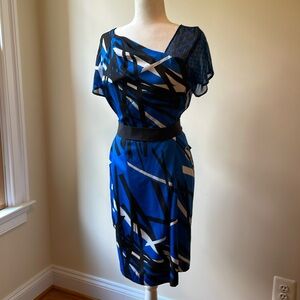 New York & Company blue black asymmetrical dress. Tie back. Size Medium.